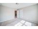 Neutral bedroom with white trim and doors, carpeted floor, and ample natural light streaming through at 1216 Foxcroft Ln, Cumming, GA 30041