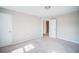Cozy bedroom featuring a carpeted floor, white trim, and a closet with a door ajar at 1216 Foxcroft Ln, Cumming, GA 30041