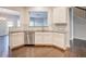 Elegant kitchen with white cabinets, hardwood floors, and stainless steel dishwasher at 1216 Foxcroft Ln, Cumming, GA 30041