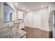 Spacious kitchen with wooden floors, stainless steel appliances, and granite countertops at 1216 Foxcroft Ln, Cumming, GA 30041
