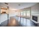 Inviting living area featuring a fireplace, hardwood flooring, and access to a modern kitchen at 1216 Foxcroft Ln, Cumming, GA 30041