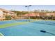 Well-maintained community tennis courts offer a recreational amenity surrounded by lush landscaping and homes at 1216 Foxcroft Ln, Cumming, GA 30041