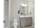 Modern bathroom with a neutral color palette, featuring a sleek vanity and a convenient shower area at 1811 Kent Ave, Dunwoody, GA 30338