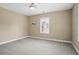 Neutral-painted bedroom features a window with a view at 1811 Kent Ave, Dunwoody, GA 30338