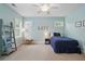 Bright bedroom with blue accents, featuring a single bed and a playful, comfortable atmosphere at 1811 Kent Ave, Dunwoody, GA 30338