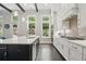 A gourmet kitchen with granite countertops, stainless steel appliances, and dark wood floors at 1811 Kent Ave, Dunwoody, GA 30338