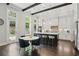 Bright kitchen with stainless steel appliances, a large island, and a cozy breakfast nook at 1811 Kent Ave, Dunwoody, GA 30338