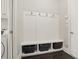 Mudroom featuring storage bench with hooks and shelves, convenient for organization at 1811 Kent Ave, Dunwoody, GA 30338