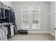 Bright walk-in closet with ample storage space for clothing and accessories at 1811 Kent Ave, Dunwoody, GA 30338