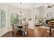 Cozy breakfast nook with natural light, a modern chandelier, and views of the outdoors at 1880 Barrett Dr, Cumming, GA 30040