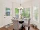 Cozy breakfast nook with natural light, a modern chandelier, and views of the outdoors at 1880 Barrett Dr, Cumming, GA 30040