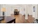 Inviting dining room with hardwood floors, a chandelier, and easy access to other living spaces at 1880 Barrett Dr, Cumming, GA 30040