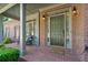 Inviting brick front porch with stylish lighting and a 'Home Sweet Home' welcome mat at 1880 Barrett Dr, Cumming, GA 30040