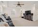 Spacious living room with leather seating and entertainment center at 1880 Barrett Dr, Cumming, GA 30040