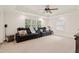 Cozy living room with theater seating, ceiling fan, and coffered ceiling at 1880 Barrett Dr, Cumming, GA 30040