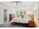Bright and airy primary bedroom with bay windows and a tray ceiling, adjacent to the ensuite bathroom at 1880 Barrett Dr, Cumming, GA 30040