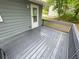 Spacious outdoor deck, perfect for entertaining or relaxing, with a freshly stained surface at 214 Sweetwater Cir, Powder Springs, GA 30127