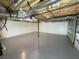 Unfinished basement with gray painted floor and visible ductwork, offering flexible space at 214 Sweetwater Cir, Powder Springs, GA 30127