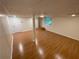 Finished basement area features wood-look flooring, a large window, and an exit door at 214 Sweetwater Cir, Powder Springs, GA 30127