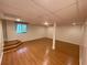 Spacious finished basement area with new floors, a large window, and neutral paint at 214 Sweetwater Cir, Powder Springs, GA 30127