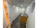 Basement featuring stone-look flooring, a wet bar, and a full-size window at 214 Sweetwater Cir, Powder Springs, GA 30127