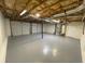 Spacious unfinished basement with updated gray painted floor, ready for customization at 214 Sweetwater Cir, Powder Springs, GA 30127