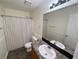Bright bathroom featuring a shower-tub combination and a single sink vanity at 214 Sweetwater Cir, Powder Springs, GA 30127