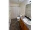 Bright bathroom featuring a shower-tub combination and a single sink vanity at 214 Sweetwater Cir, Powder Springs, GA 30127