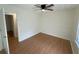 Bright bedroom with natural light featuring hardwood floors, trim, and a modern ceiling fan at 214 Sweetwater Cir, Powder Springs, GA 30127
