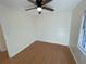 Clean bedroom showing hardwood floors and a modern ceiling fan with lights, creating a comfortable atmosphere at 214 Sweetwater Cir, Powder Springs, GA 30127