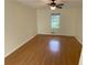 Charming bedroom with hardwood floors, natural light from the window, and ample space at 214 Sweetwater Cir, Powder Springs, GA 30127