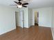 Bright bedroom featuring hardwood floors, a ceiling fan and an en-suite bathroom at 214 Sweetwater Cir, Powder Springs, GA 30127