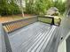 This gray painted wooden deck has a railing and provides a serene outdoor space at 214 Sweetwater Cir, Powder Springs, GA 30127