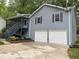 Charming two-story home featuring a two-car garage and a welcoming front porch at 214 Sweetwater Cir, Powder Springs, GA 30127