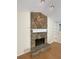 The rock fireplace features a mantel and stone hearth in this comfortable living room at 214 Sweetwater Cir, Powder Springs, GA 30127