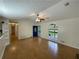 Spacious living room with hardwood floors, ceiling fan and view to exterior deck at 214 Sweetwater Cir, Powder Springs, GA 30127