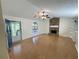 Spacious living room with hardwood floors, rock fireplace and view to exterior deck at 214 Sweetwater Cir, Powder Springs, GA 30127