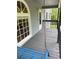 A blue swing is a relaxing feature on this porch that is protected from the elements at 214 Sweetwater Cir, Powder Springs, GA 30127
