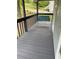 A porch with a wooden swing painted blue is a great place to relax at 214 Sweetwater Cir, Powder Springs, GA 30127