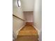 Wooden staircase leading to the next level, illuminated by modern lighting at 214 Sweetwater Cir, Powder Springs, GA 30127