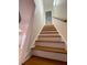 A staircase with wood treads leads to the next level of this bright home at 214 Sweetwater Cir, Powder Springs, GA 30127