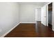 A bedroom featuring beautiful dark hardwood floors and neutral colored walls at 3653 Mecklinburg Pl, Decatur, GA 30032