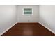 Simple bedroom space with hardwood floors and natural light at 3653 Mecklinburg Pl, Decatur, GA 30032