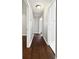 A hallway featuring beautiful dark hardwood floors and neutral colored walls at 3653 Mecklinburg Pl, Decatur, GA 30032