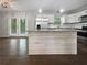 Modern kitchen featuring stainless steel appliances, a breakfast bar, and plenty of natural light at 3653 Mecklinburg Pl, Decatur, GA 30032