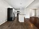 Functional kitchen with stainless appliances, center island, and hardwood floors at 3653 Mecklinburg Pl, Decatur, GA 30032