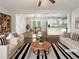 Bright, airy living room with hardwood floors, white sofas, and open floor plan at 3653 Mecklinburg Pl, Decatur, GA 30032