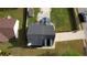 An aerial view showing the house and its yard, featuring a fire pit and gazebo at 1700 Conductor Ln, Conyers, GA 30013