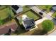 Aerial view of a home featuring a fenced backyard, fire pit, storage shed, and a lush lawn at 1700 Conductor Ln, Conyers, GA 30013
