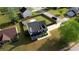 Aerial view of two story home on a corner lot with green lawn and mature landscaping at 1700 Conductor Ln, Conyers, GA 30013